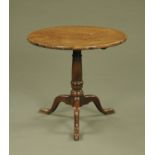 A George III mahogany tripod table, with snap action,