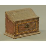A 19th century leather bound stationery casket, with Serpentine top opening to a fitted interior.