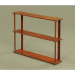 A 19th century mahogany three tier open shelf unit, with ring turned supports. Width 68.