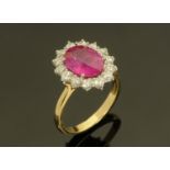 An 18 ct yellow gold fine pink sapphire and diamond cluster ring, pink sapphire +/- 3.14 carats.