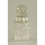 A cut glass scent bottle, with faceted stopper and with silver mount Birmingham 1899. Height 18 cm.