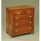 An oak chest of drawers,