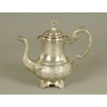 A Persian white coloured metal teapot. Height 24 cm.