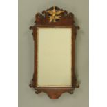 A George III mahogany Chippendale style fretwork wall mirror, with hoho bird pediment.