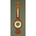 A Victorian carved oak aneroid barometer, 89 cm high.