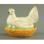 A 19th century Staffordshire hen on nest egg cruet, yellow base, gilt highlighted hen.