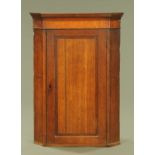 A 19th century oak corner cupboard,