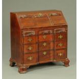 A Georgian mahogany bureau, in the American block front style,