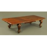 A large Victorian mahogany extending dining table with three leaves, with telescopic action,