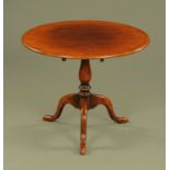 An oak tripod table,