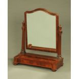 A Victoria mahogany toilet mirror, the base with shaped sliding compartment. Width 70 cm.