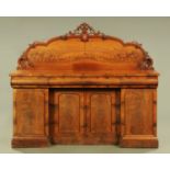 A large Victorian mahogany sideboard, with rear upstand and inverted breakfront,