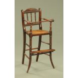 A 19th century mahogany child's highchair,