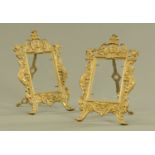 A pair of embossed brass photograph frames, each with easel back. Height 29 cm, width 18.5 cm.