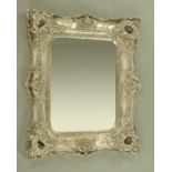 A large silver painted double framed mirror, with bevelled glass. Height 124 cm, width 100 cm.