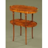 A yew wood veneered oval two tier stand,