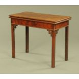 A George III mahogany turnover top games table,