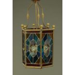 A large Victorian hall lantern, hexagonal, with leaded and stained glass panels.