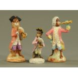 Three monkey band figures, two earthenware one porcelain, each polychrome. Tallest 15 cm.