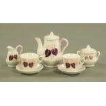 A Victorian dolls tea set, comprising 2 cups, 2 saucers, sugar basin, milk jug and teapot.