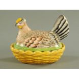 A 19th century Staffordshire hen on nest egg cruet, yellow base, yellow comb, coloured bird.