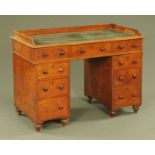 A Victorian mahogany pedestal desk, with three quarter gallery,