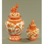 Two Kutani lidded vases, one with dog terminal the other figural, both with character marks.