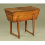 A 19th century oak dough bin, of typical form, raised on moulded legs united by stretchers.
