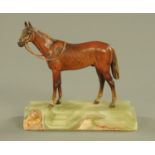 A German cold painted bronze of an Arab stallion, with bridle, raised on an onyx plinth,