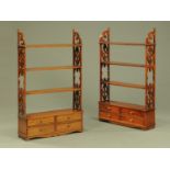 A pair of George III style wall mounting open shelf units each fitted with four drawers and with