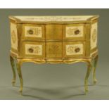 An Italian gilt and cream painted chest of two drawers, raised on cabriole legs, circa 1960.