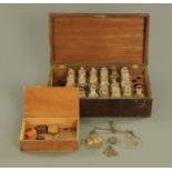 A mahogany case of apothecary bottles, (21), each +/- 9 cm, and a cased pair of apothecary scales.