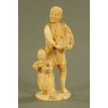 A late 19th/early 20th century Japanese carved ivory figure group, farmer and son, signed to base.