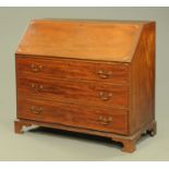 A George III inlaid mahogany bureau, with slope front to fitted interior,