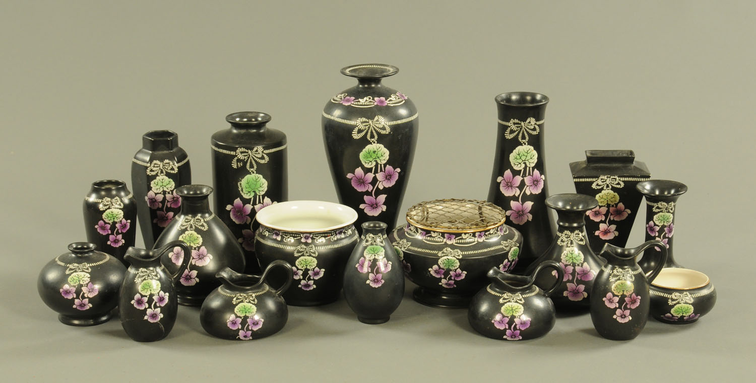 Eighteen pieces of Shelley Violette ware, with black ground. Tallest 25.5 cm.