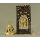 A Chinese wooden bell stand and brass bell.