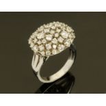 An 18 ct white gold diamond set dress ring, +/- 1.55 carats. Size N.