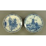 A pair of blue and white printed chargers each bearing mark Delfts Blauw,