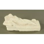 A carved alabaster figure of a reclining nude on daybed. Length 39 cm.