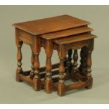 A nest of three Chapmans Siesta oak occasional tables. Largest width 49.5 cm.