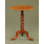 A Victorian mahogany tripod table, with dished top,
