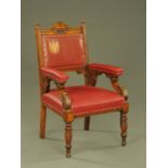 A late Victorian oak Civic armchair, the leather upholstered back with coat of arms,