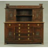 A late 19th/early 20th century Arts & Crafts oak sideboard,