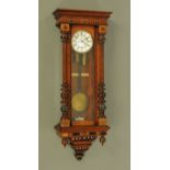 A walnut cased Vienna regulator wall clock, of large form, with two-train striking movement.