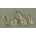 Silver and white metal novelties, comprising a shrimp spoon, two guitars and a banjo. Longest 9.