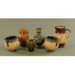 A Victorian Doulton Golden Jubilee jug, height 19 cm, four Doulton jugs, tygs,