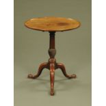 A George III mahogany tripod table, with dished top and snap action,