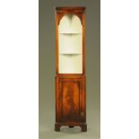 A mahogany standing corner cupboard, of narrow proportions,