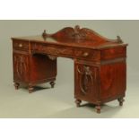 A 19th century Hepplewhite style pedestal sideboard, with rear foliate and plume carved upstand,