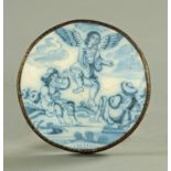 An 18th century Delft roundel, in metal mount, diameter 10 cm.